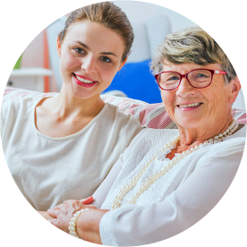 caregiver and senior woman smiling